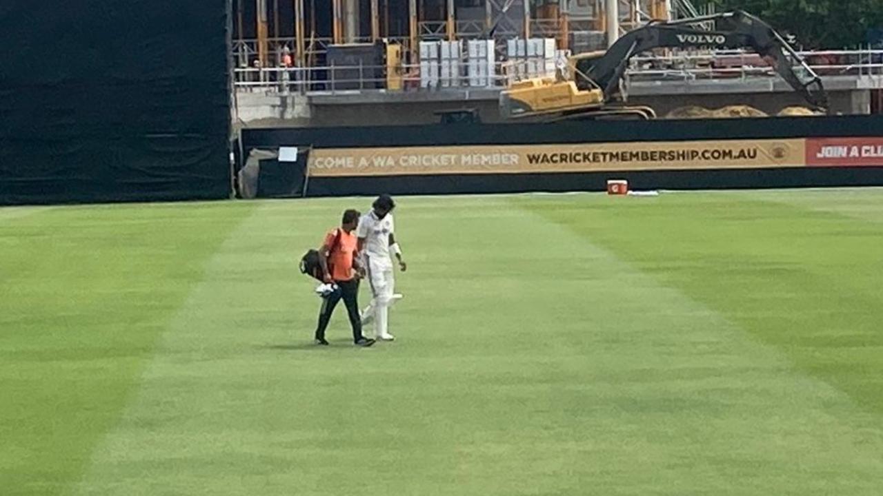 KL Rahul walks off the field after sustaining a injury on his right elbow