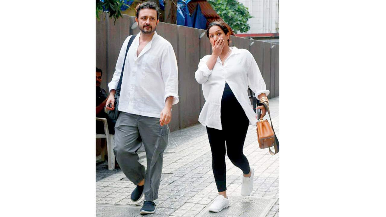 Up and about: Mom-to-be Masaba Gupta takes a walk with hubby Satyadeep Mishra